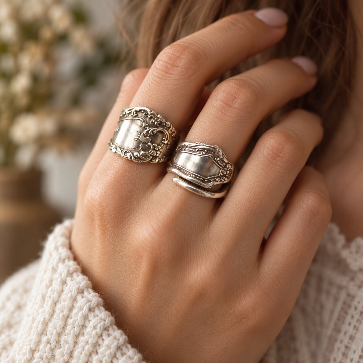 Two handcrafted Silver Bent spoon rings being worn